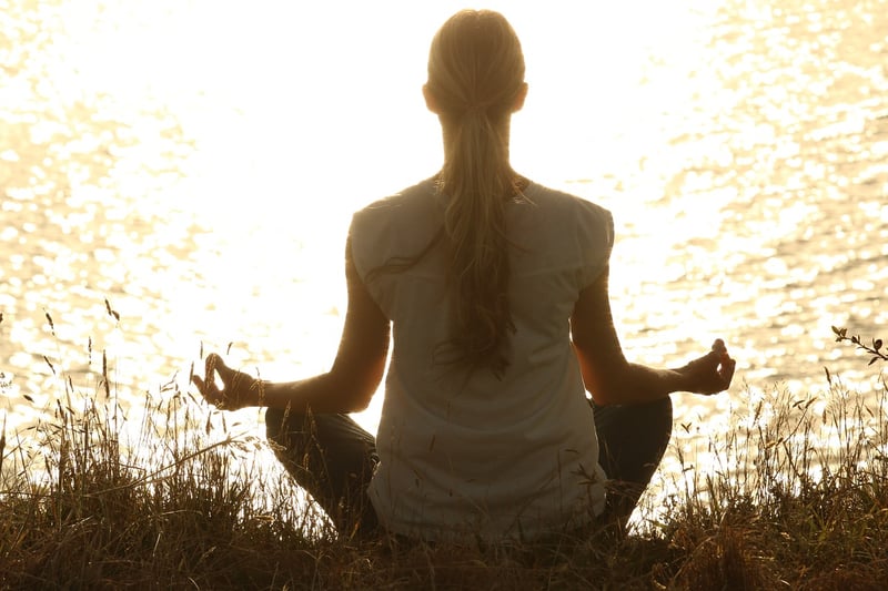 Yoga silhouette at sunrise